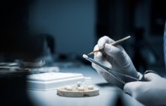 Ceramist creating a dental crown