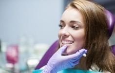 Young woman smiling in dental chair