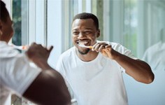Closeup of man breaking cigarette
