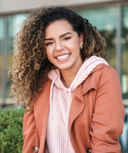 Smiling woman sitting outside
