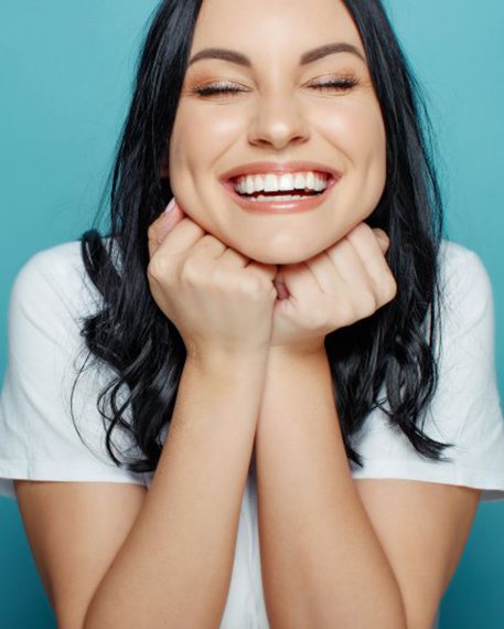 Lady smiles radiantly?