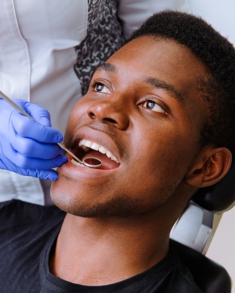 Man receiving a dental exam