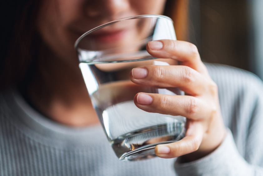 Woman drinking glass of water