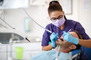 Dentist working on patient. 